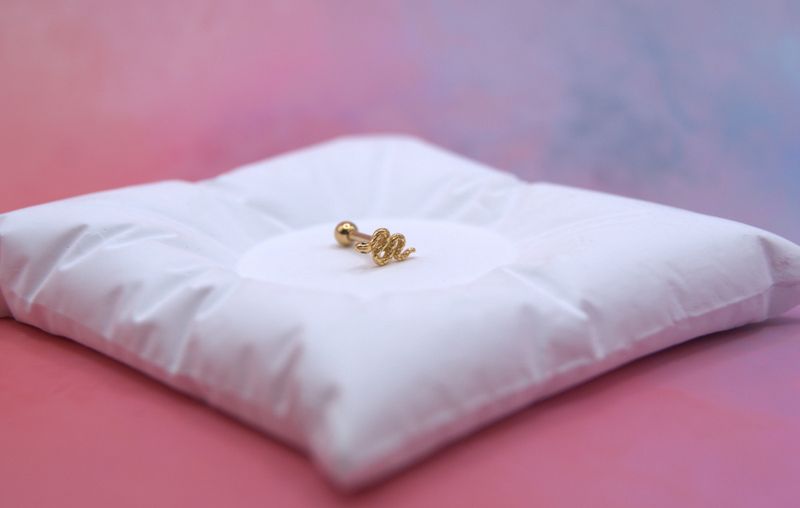 Golden Snake piercing